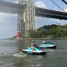 Group of riders on Hudson River jet ski tour under the George Washington Bridge